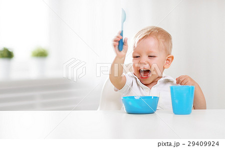 Happy baby eating himself 29409924
