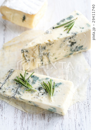 Various types of cheese on the wooden board Various types of cheese on the wooden board 29411740