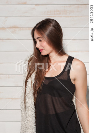 Young woman standing in night dress side view Young woman standing in night dress side view 29415055