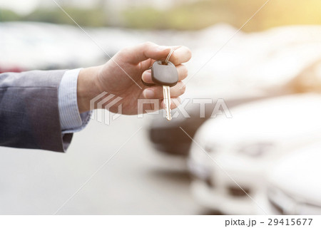 Hand with car key Hand with car key 29415677