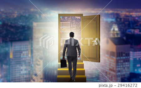 Businessman walking towards open door Businessman walking towards open door 29416272