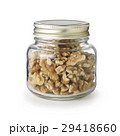 walnuts in glass jar isolated on white background. 29418660