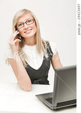 Pretty businesswoman making a phone call Pretty businesswoman making a phone call 29423897