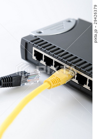 Network switch device and ethernet cables on white 29426379