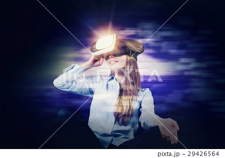 Woman wears virtual reality glasses Woman wears virtual reality glasses 29426564