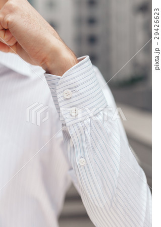 Close up of a businessman showing a shirt cuff Close up of a businessman showing a shirt cuff 29426623