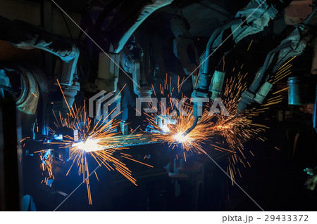 Team robots are welding automotive part. 29433372