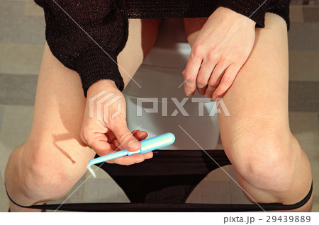 tampon in hand of woman tampon in hand of woman 29439889