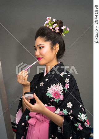 Geisha in traditional Japanese kimono makeup. Geisha in traditional Japanese kimono makeup. 29441899
