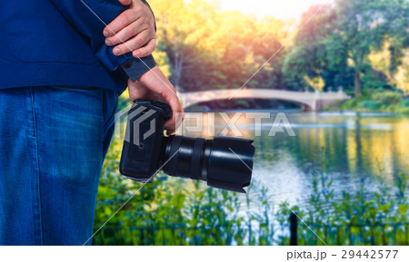 Male cameraman hands with digital camera 29442577
