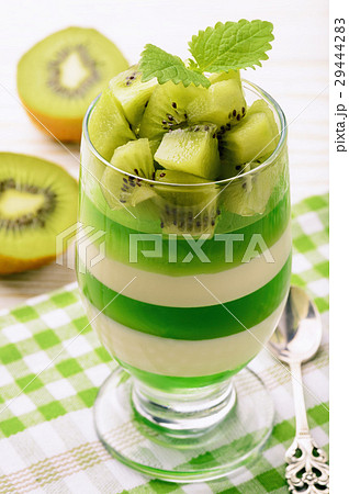 Panna cotta with kiwi jelly and kiwi fruits. 29444283