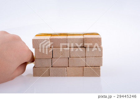 Yellow color measuring tape and domino Yellow color measuring tape and domino 29445246