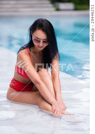 Elegant sexy woman in the red bikini on the sun Elegant sexy woman in the red bikini on the sun 29446251