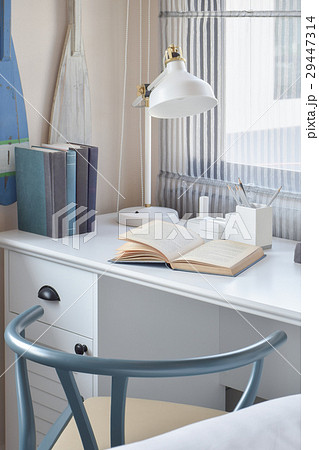 working table with wooden chair,books and lamp 29447314