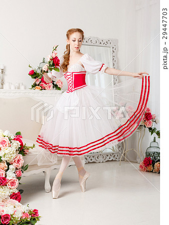 Pretty ballerina holding flowers 29447703