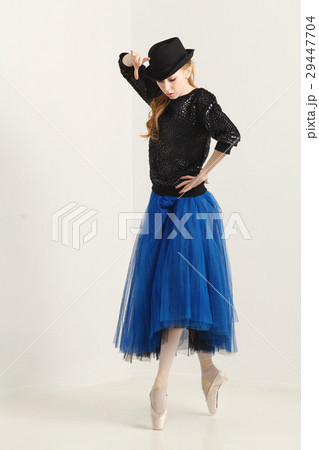 Ballerina in pointe shoes dancing with hat Ballerina in pointe shoes dancing with hat 29447704