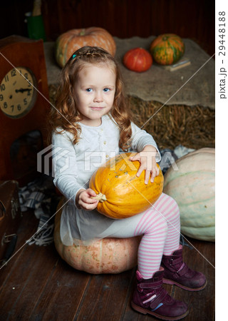 Portrait of adorable smiling girl posing with 29448188
