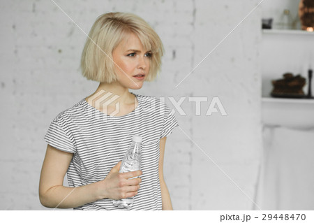 Young girl with bottle of water 29448470