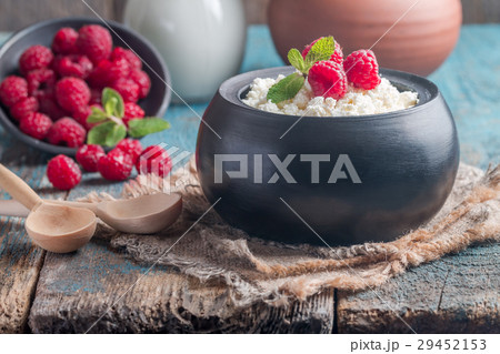 Fresh homemade cottage cheese with raspberries Fresh homemade cottage cheese with raspberries 29452153