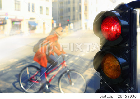 The girl on a bicycle on a city street 29455936