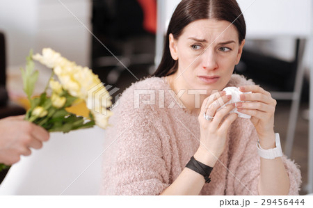 Frustrated young woman escaping flowers 29456444