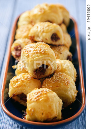 Homemade sausage rolls on wooden background. 29456809
