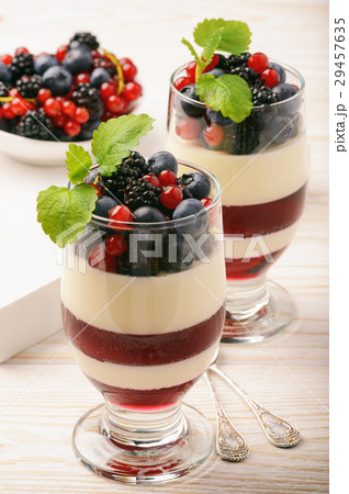 Panna cotta with berry jelly and berries. Panna cotta with berry jelly and berries. 29457635