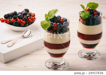 Panna cotta with berry jelly and berries. Panna cotta with berry jelly and berries. 29457636
