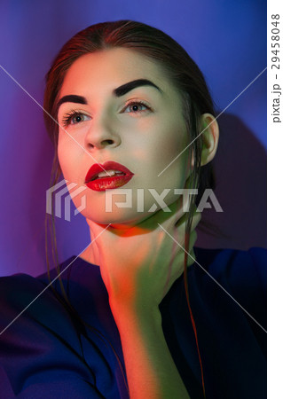 Attractive woman holding neck 29458048
