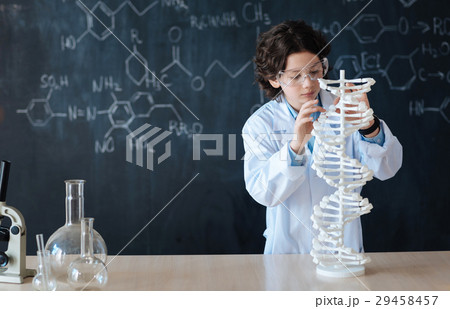 Smart pupil enjoying chemistry class at school 29458457