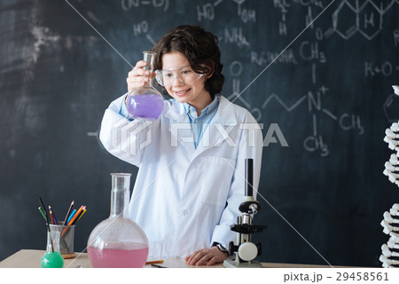 Positive little scientist enjoying chemistry 29458561