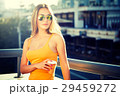 Young Fashion Woman with Coffee to Go in the City 29459272