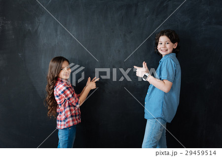 Smiling kids helping in decision in the studio Smiling kids helping in decision in the studio 29459514