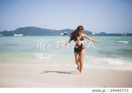 girl enjoying and runing on the beach. 29460753