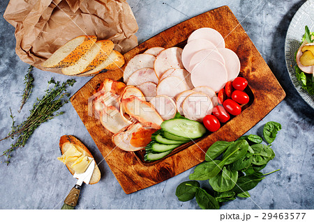 Sausage sliced different kinds, cucumbers tomatoes 29463577