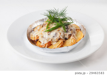 potatoes with mushrooms in foil isolated white 29463583