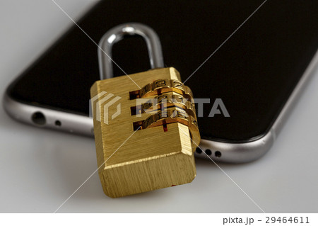 cell phone security - lock and phone on white cell phone security - lock and phone on white 29464611