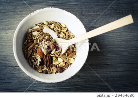 bowl with muesli and spoon on the wooden table bowl with muesli and spoon on the wooden table 29464630