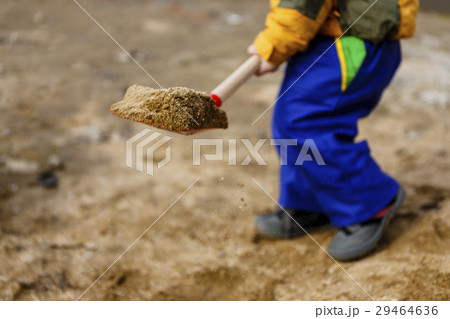 child play with sand and red shovel 29464636