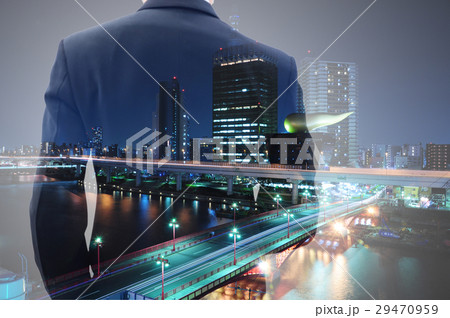 Double exposure of businessman and city at night Double exposure of businessman and city at night 29470959