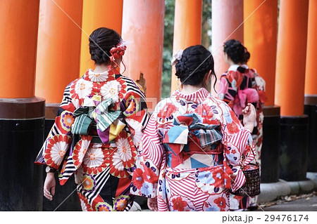 geishas among red wooden Tori Gate geishas among red wooden Tori Gate 29476174