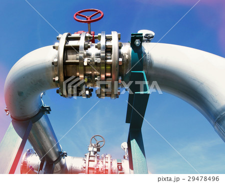 Steel pipelines and valves against blue sky 29478496