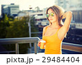 Young Fashion Woman with Coffee to Go in the City 29484404