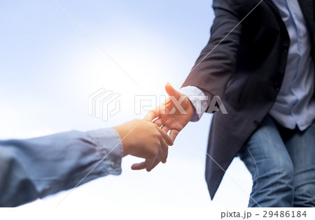 Help concept hand reaching out to helping people 29486184