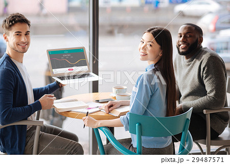 Young guy presenting information from laptop Young guy presenting information from laptop 29487571