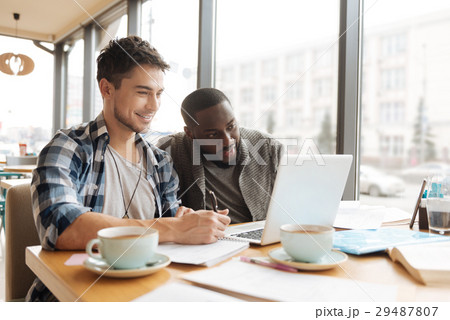Two students working on laptop together Two students working on laptop together 29487807