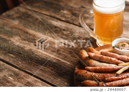 Grill sausages mix with beer, free space on wood Grill sausages mix with beer, free space on wood 29489007