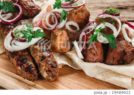 Delicious fresh grilled meat on wooden background 29489022