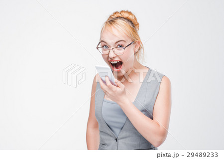 Angry woman with phone furious, enraged and mad Angry woman with phone furious, enraged and mad 29489233