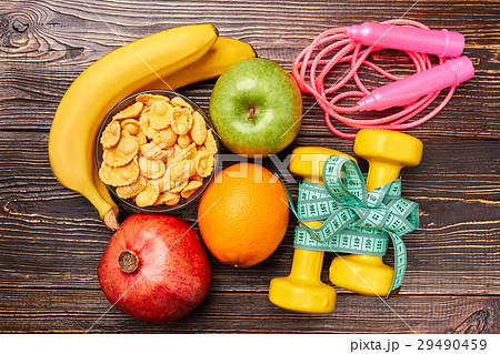 Skipping rope, dumbbells and fruit. Skipping rope, dumbbells and fruit. 29490459